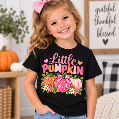 Little Pumpkin shirt design with pink leopard print, polka dot gingham bow, and pastel pumpkins surrounded by daisies black tshirt toddler