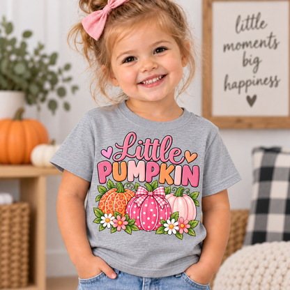 Little Pumpkin shirt design with pink leopard print, polka dot gingham bow, and pastel pumpkins surrounded by daisies